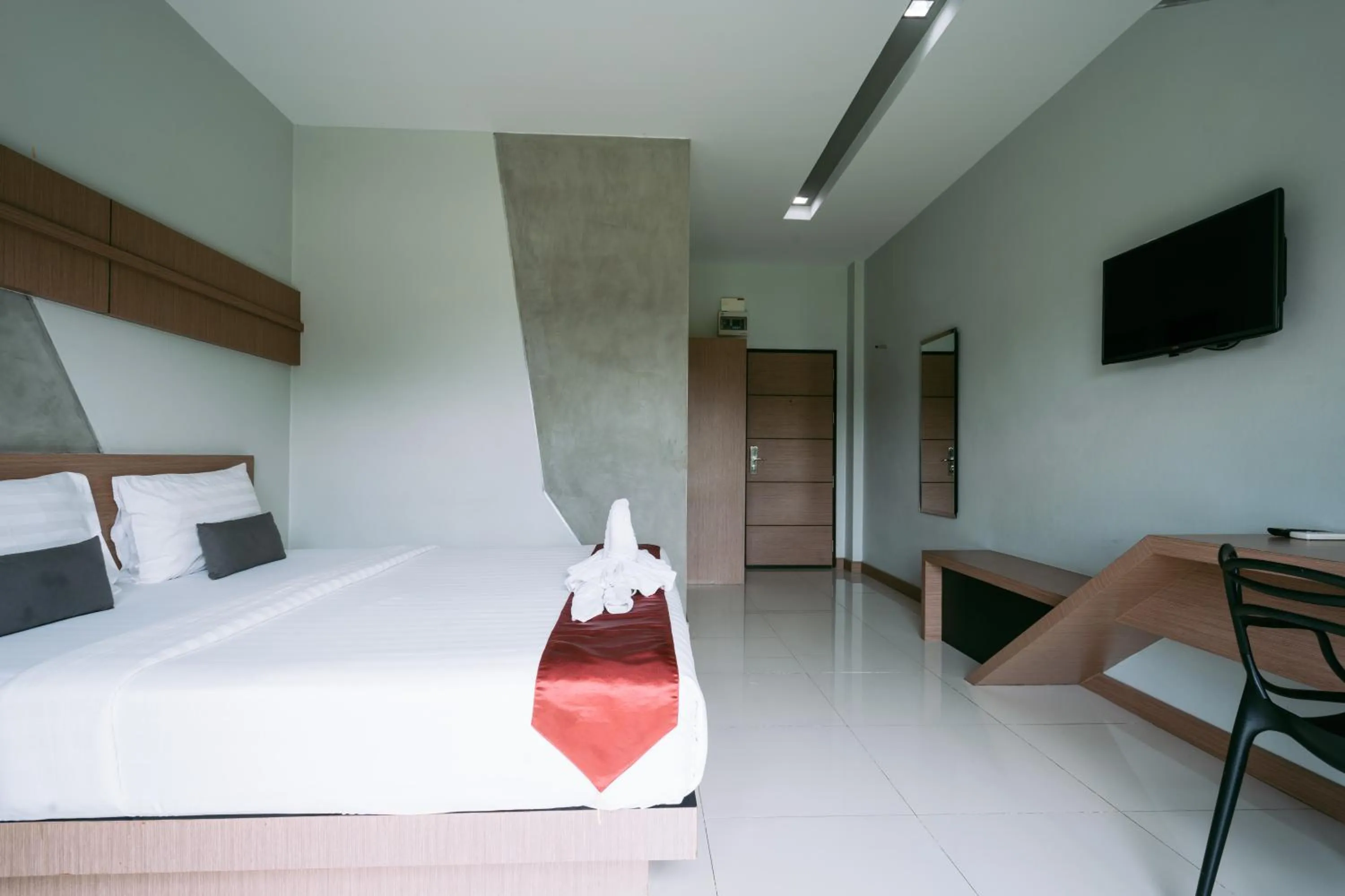 Bed in Ray Hotel Buriram