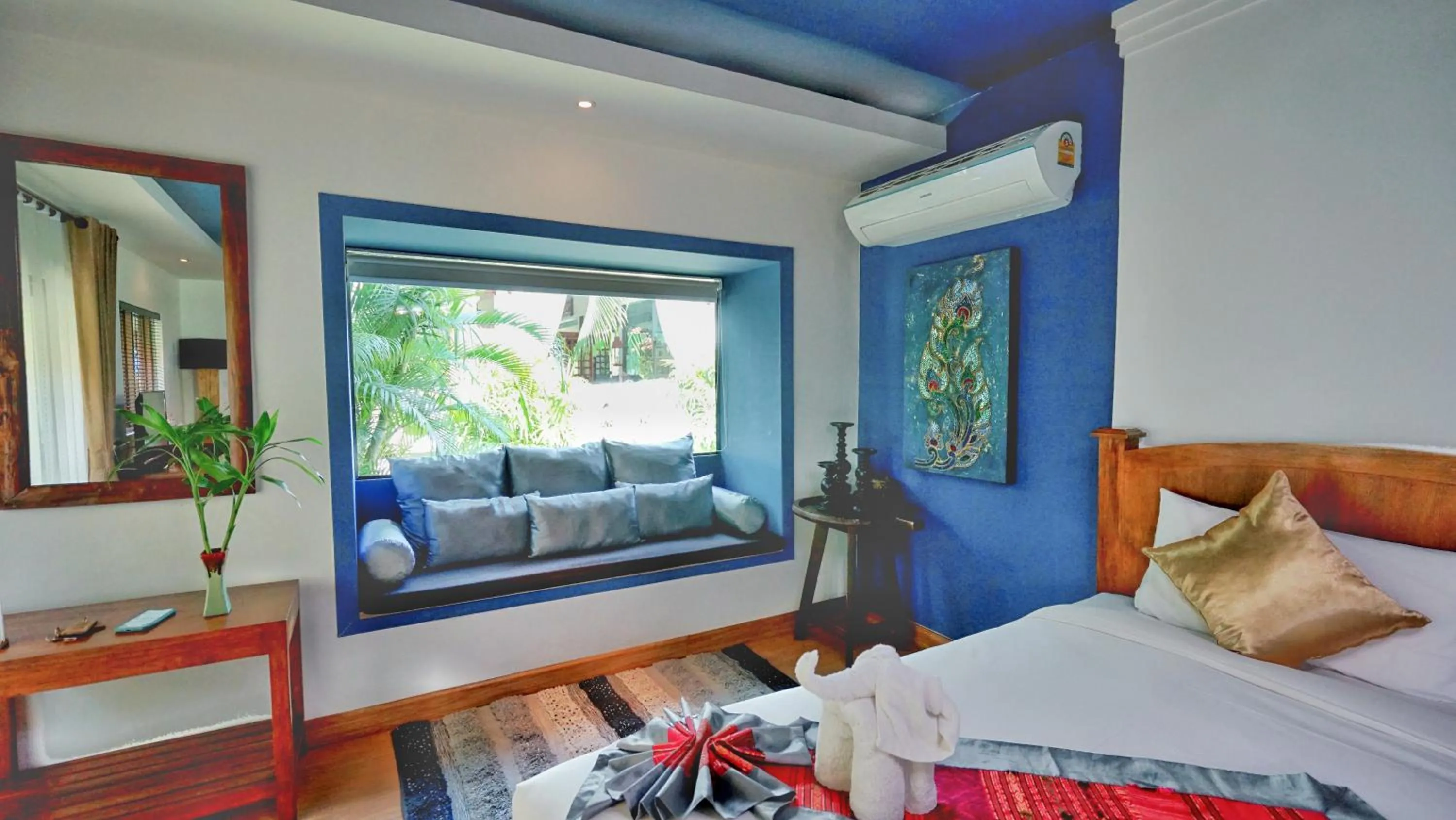 Seating area, Bed in E-outfitting Boutique Chiang Mai