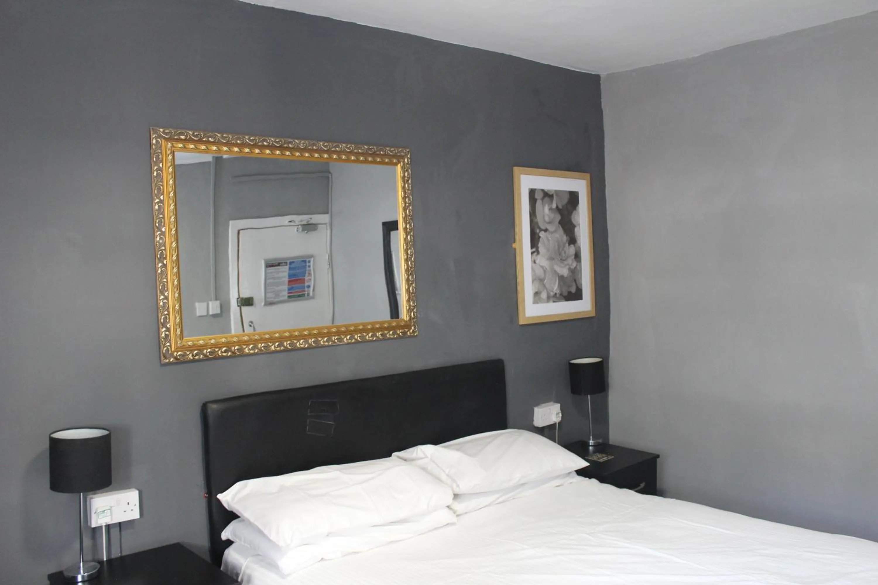 Bed in Peek-a-Booze - Budget Hotel - Adults Only