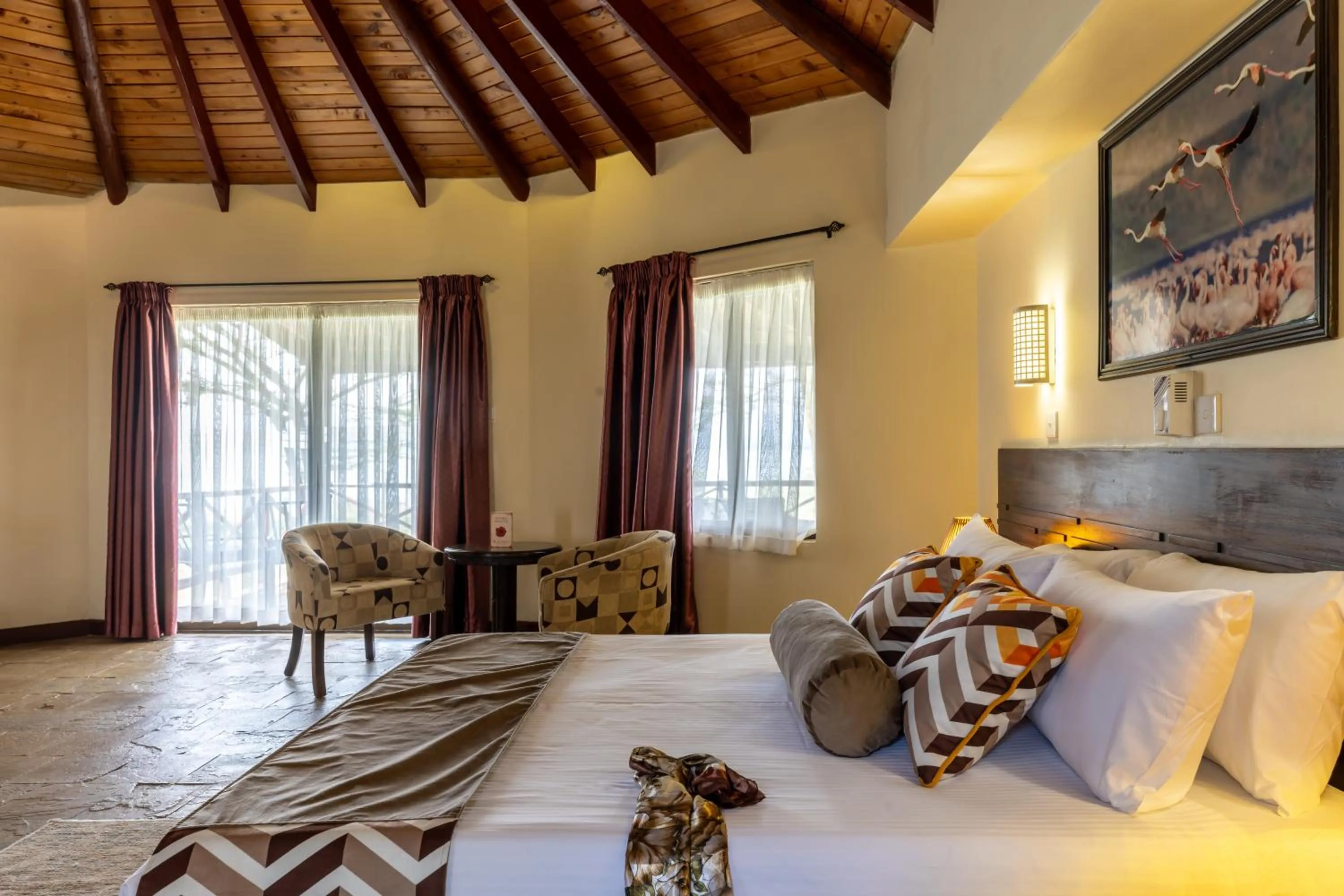 Seating area, Bed in Sentrim Elementaita Lodge