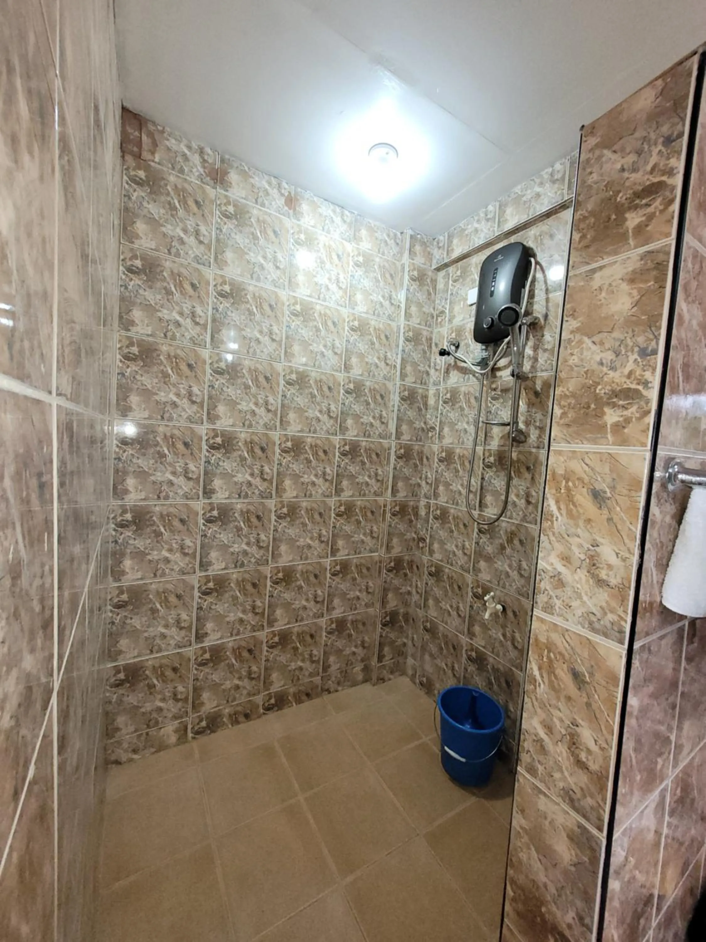 Shower in J & V Oceanview Beach Resort