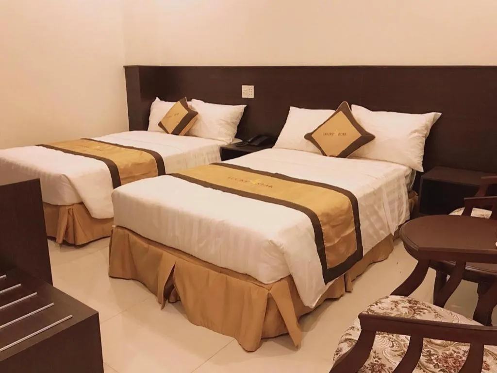 Bed in LUCKY STAR HOTEL