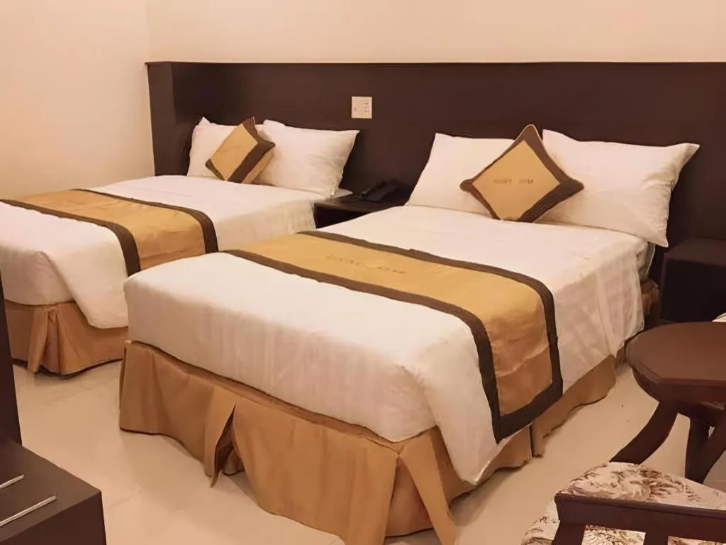 Bed in LUCKY STAR HOTEL