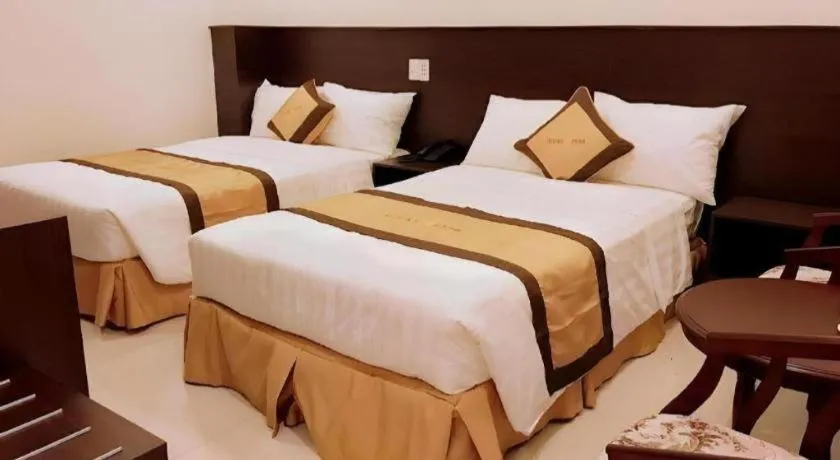 Bed in LUCKY STAR HOTEL
