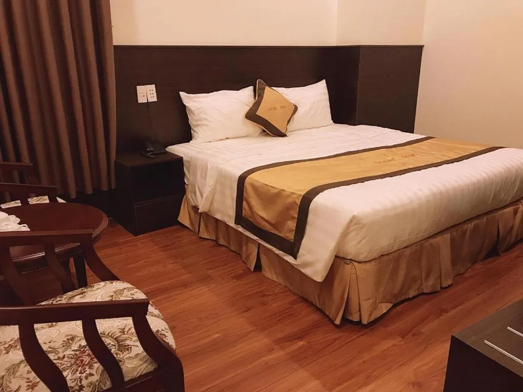 Bed in LUCKY STAR HOTEL