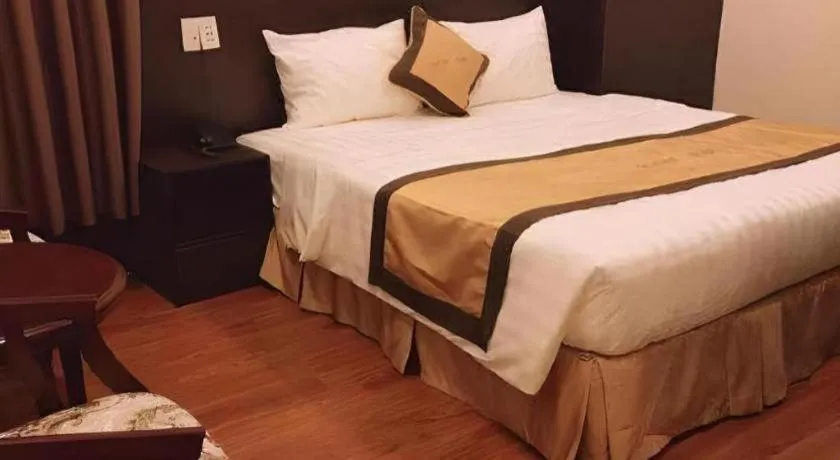 Bed in LUCKY STAR HOTEL