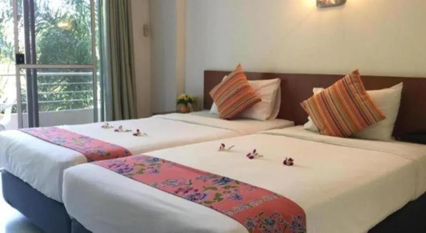 Bed in Wild Orchid Villa Krabi