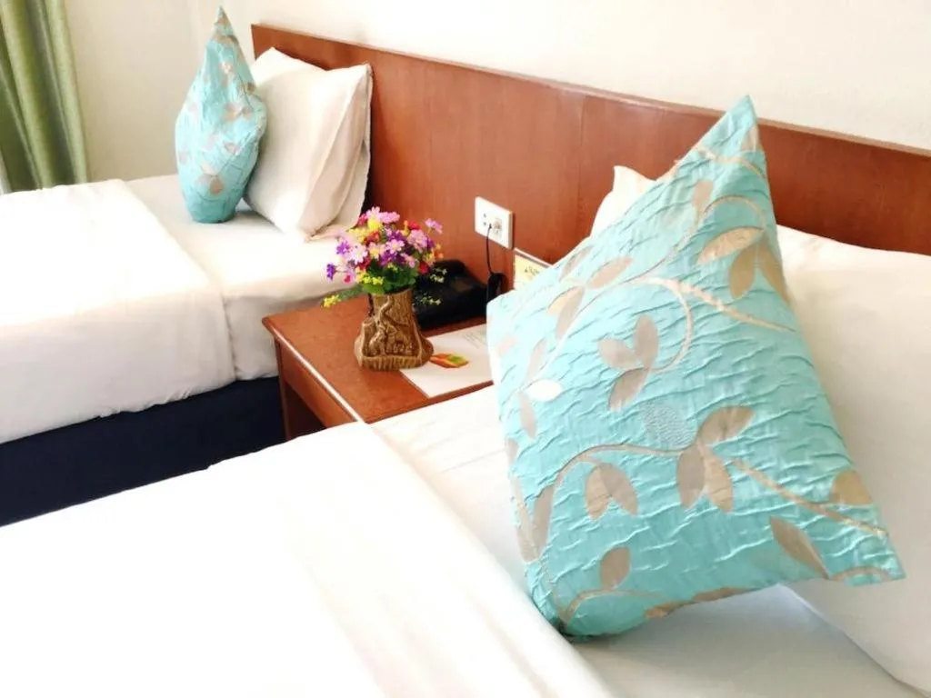 Bed in Wild Orchid Villa Krabi