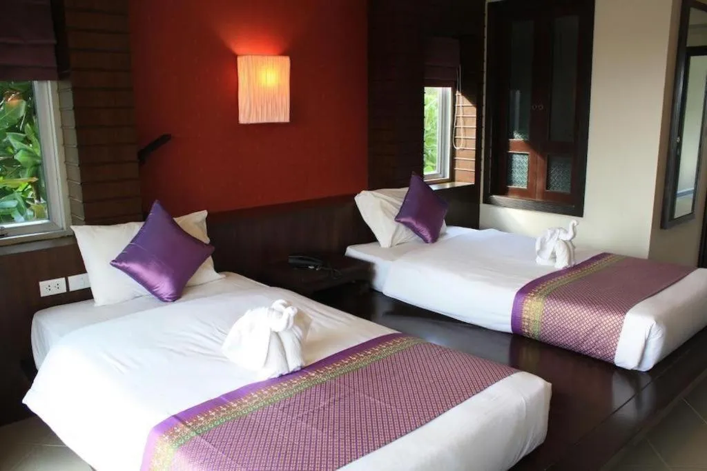 Bed in Wild Orchid Villa Krabi