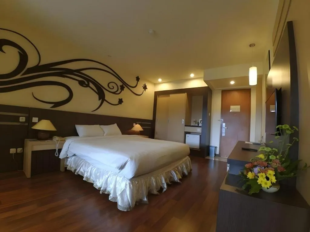 Bed in Purnama Hotel