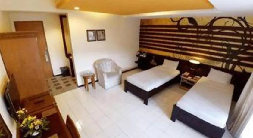 Bed in Purnama Hotel