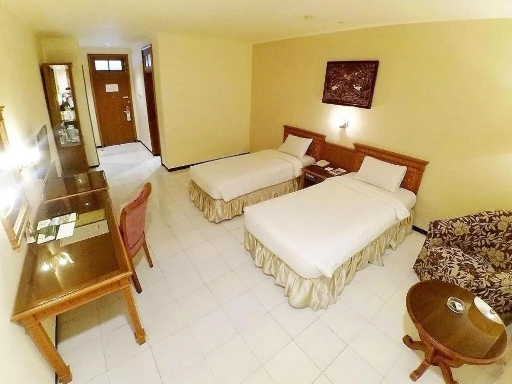 Bed in Purnama Hotel