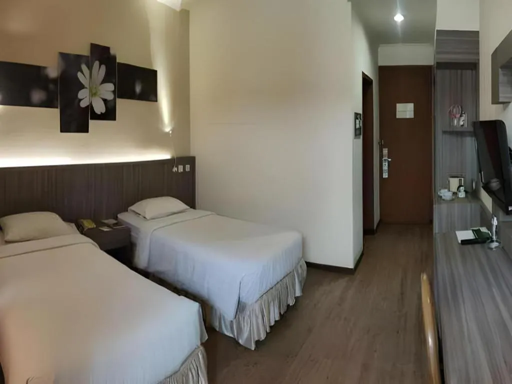 Bed in Purnama Hotel