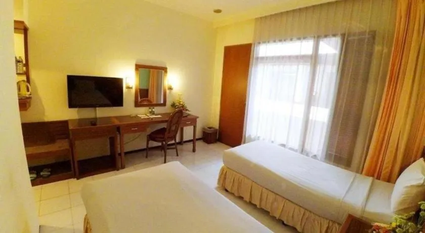 Bed in Purnama Hotel