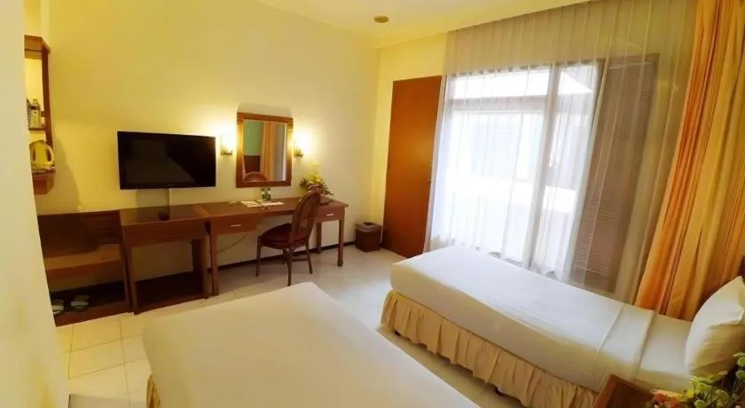 Bed in Purnama Hotel