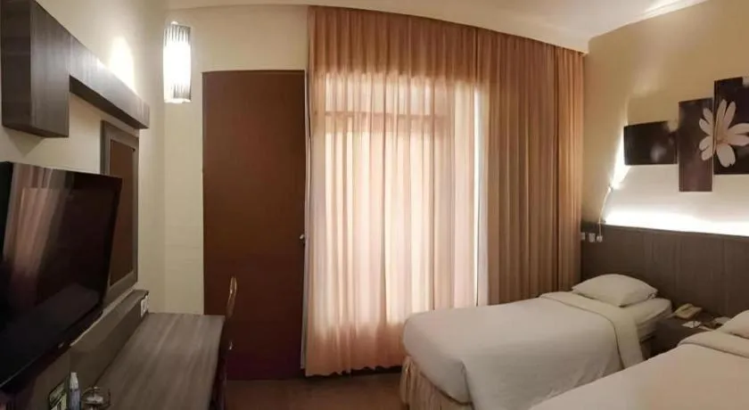 Bed in Purnama Hotel