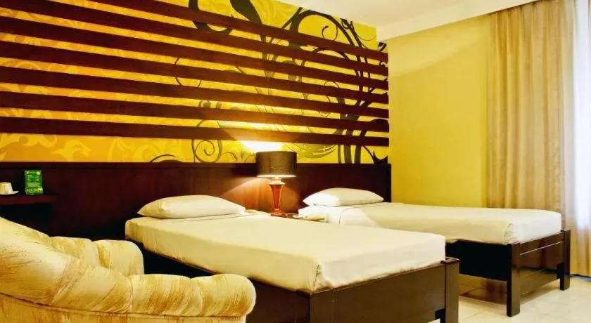 Bed in Purnama Hotel