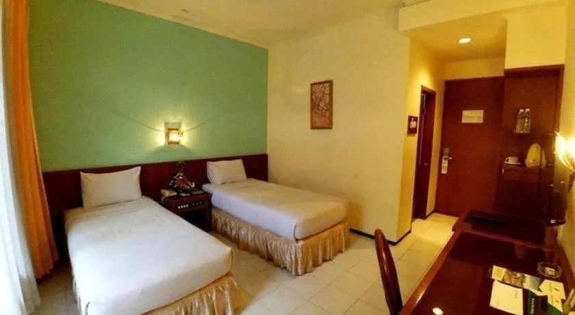Bed in Purnama Hotel