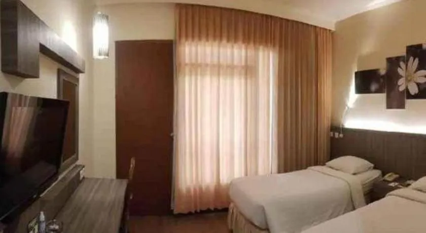 Bed in Purnama Hotel