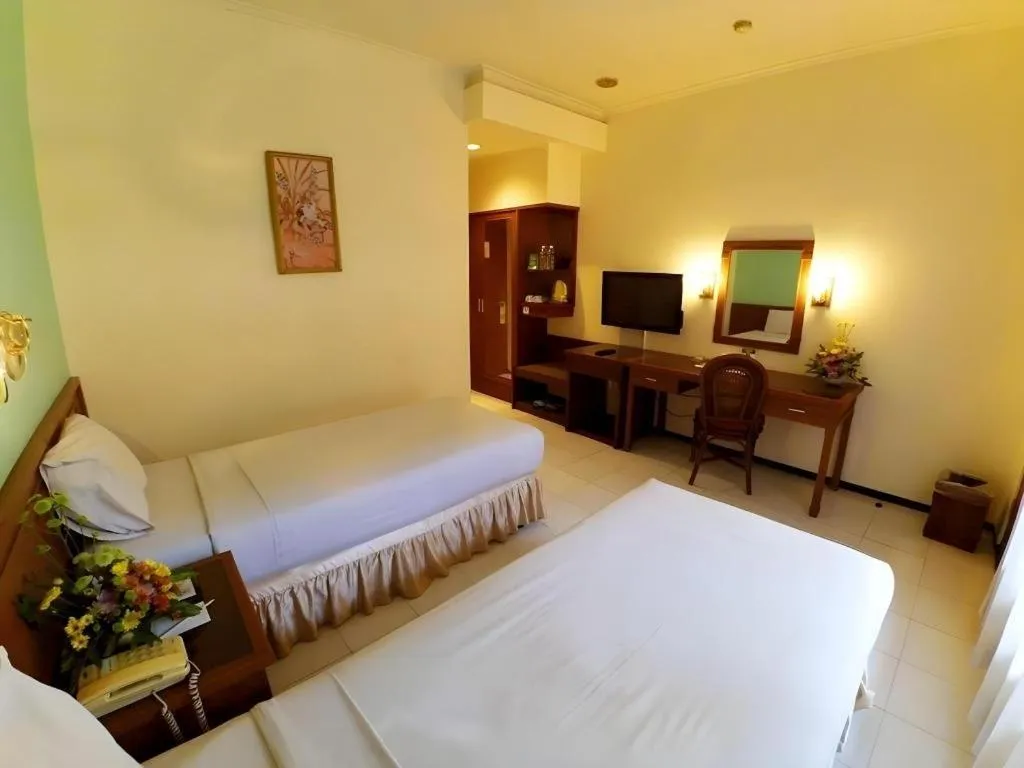 Bed in Purnama Hotel