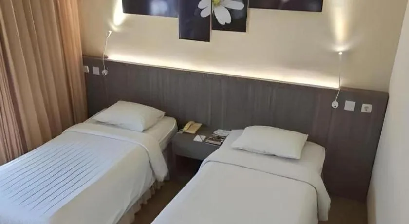 Bed in Purnama Hotel