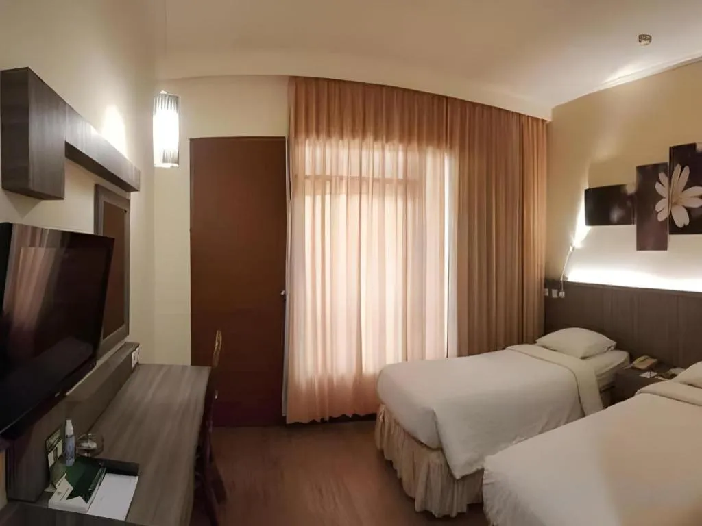 Bed in Purnama Hotel