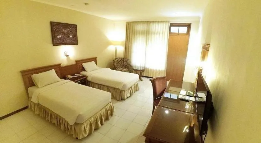 Bed in Purnama Hotel