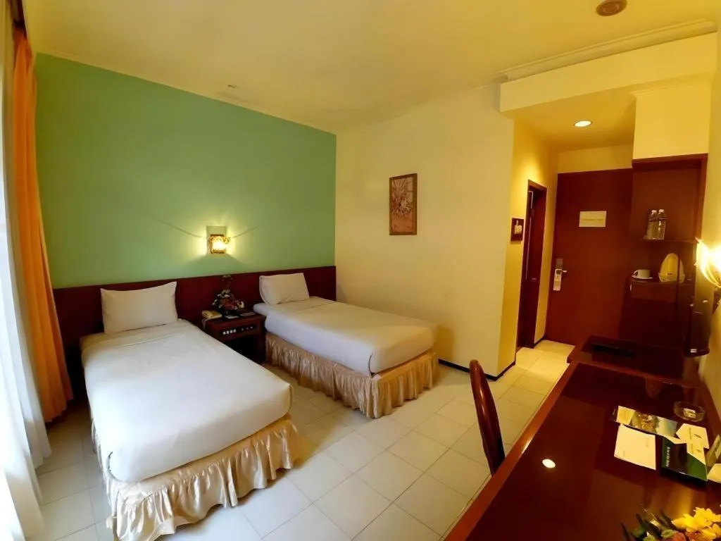Bed in Purnama Hotel
