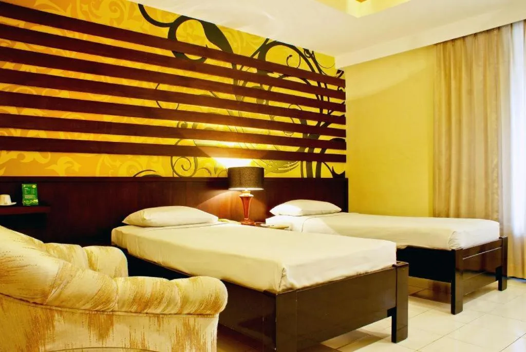 Bed in Purnama Hotel