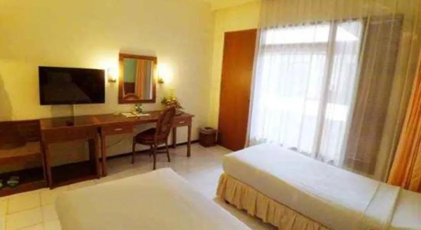 Bed in Purnama Hotel