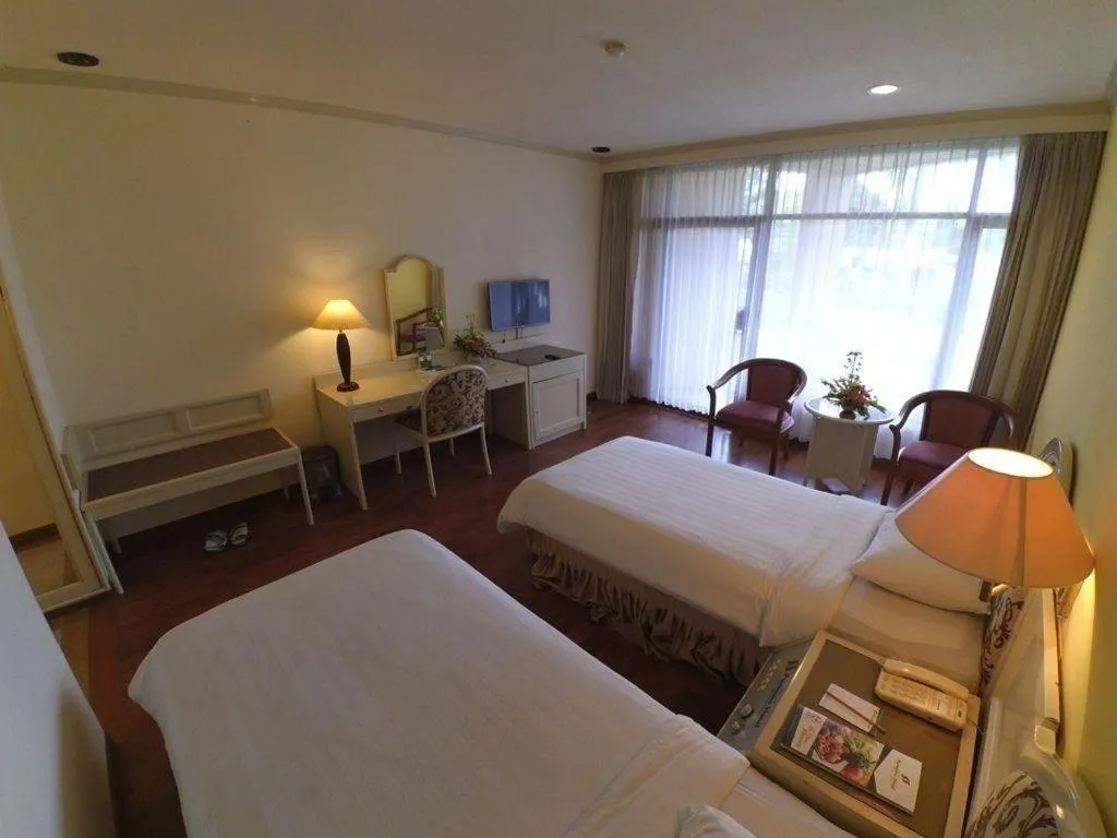 Bed in Purnama Hotel