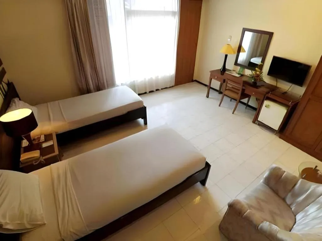 Bed in Purnama Hotel