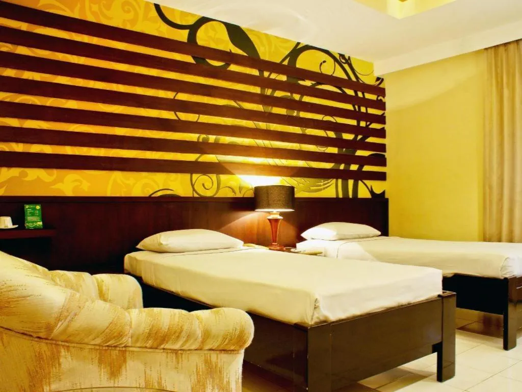 Bed in Purnama Hotel