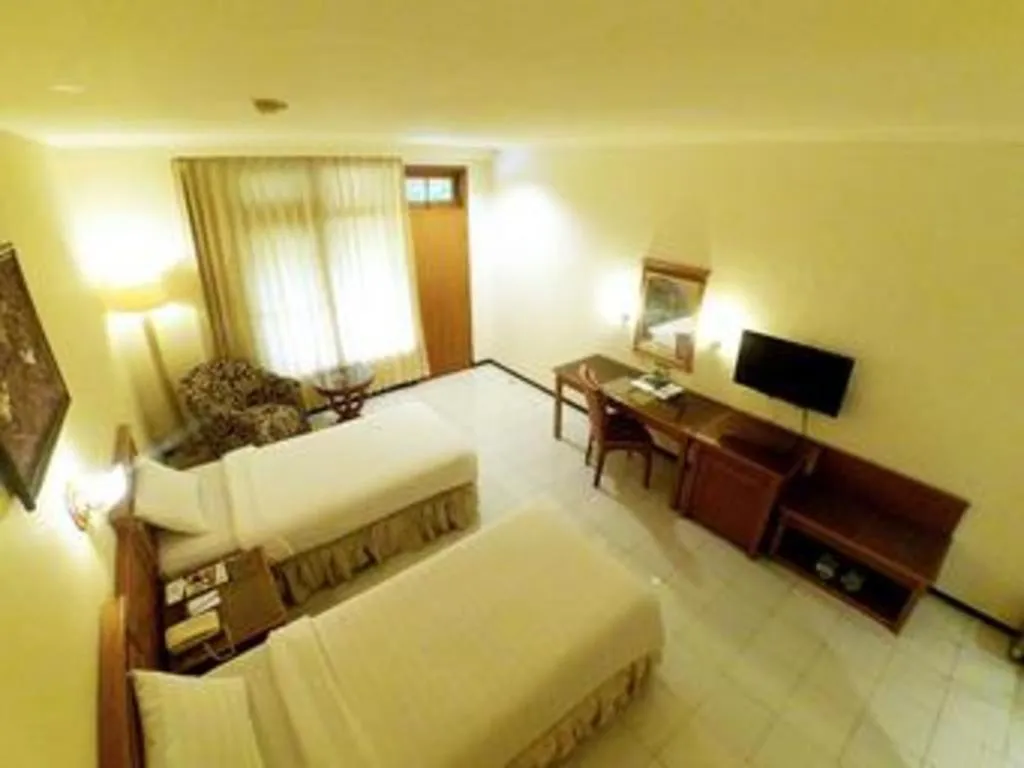 Bed in Purnama Hotel