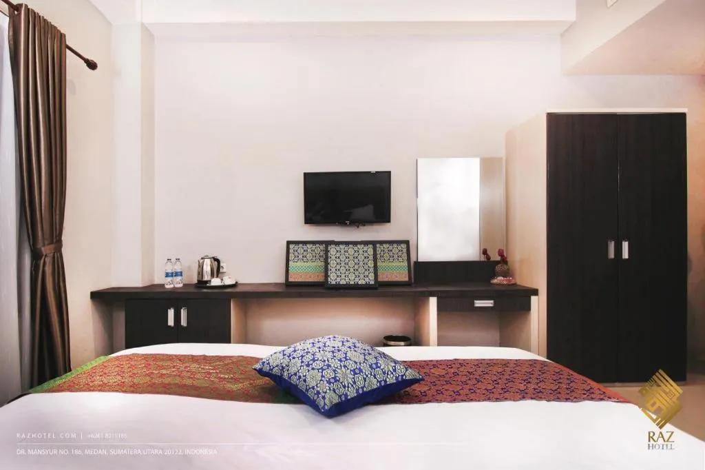 Bed in Raz Hotel and Convention