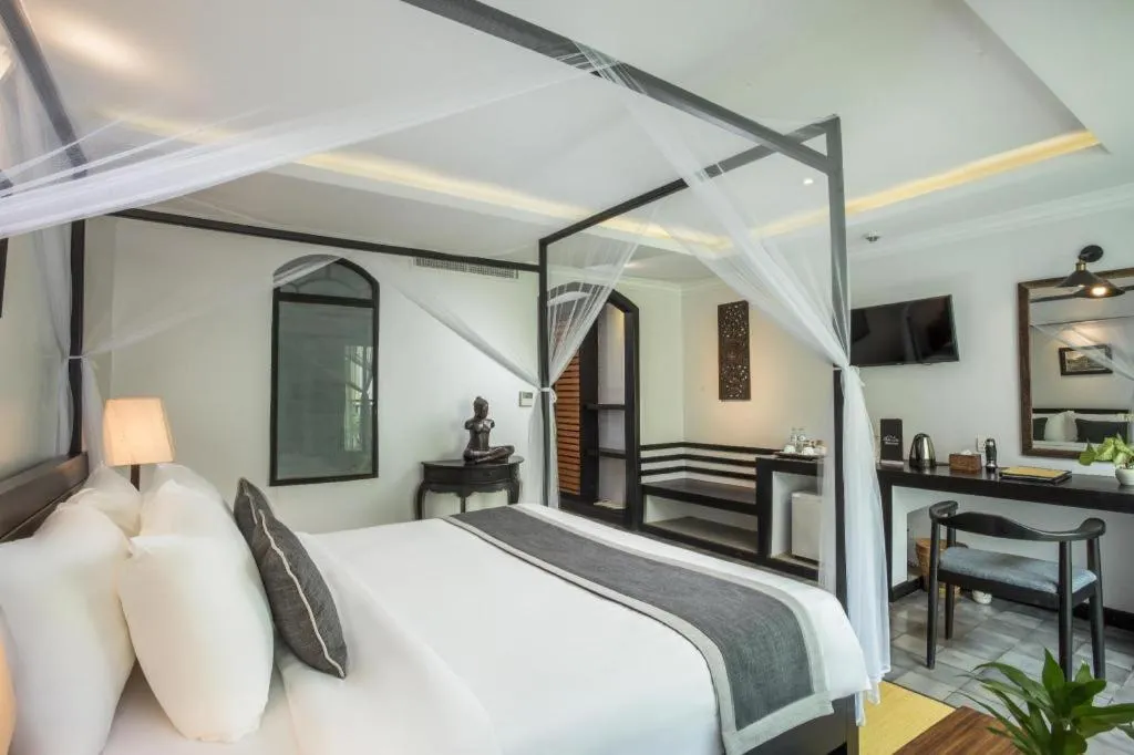 Bed in The Grand Cyclo Boutique Suite & Spa