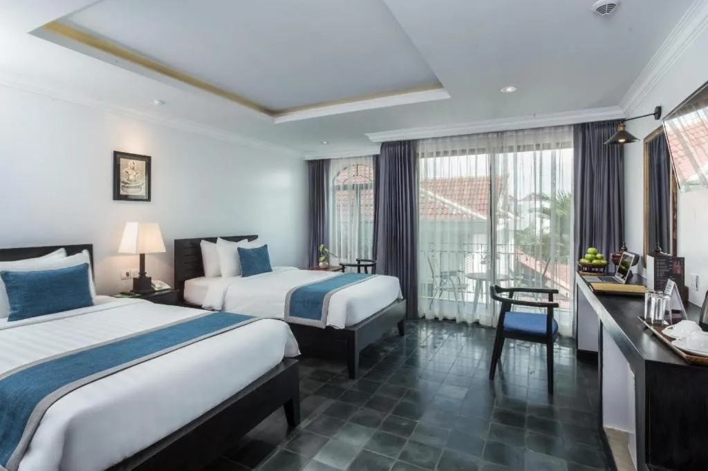 Bed in The Grand Cyclo Boutique Suite & Spa