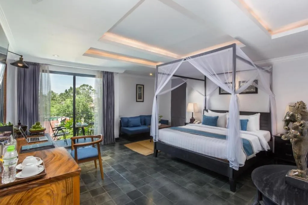 Bed in The Grand Cyclo Boutique Suite & Spa