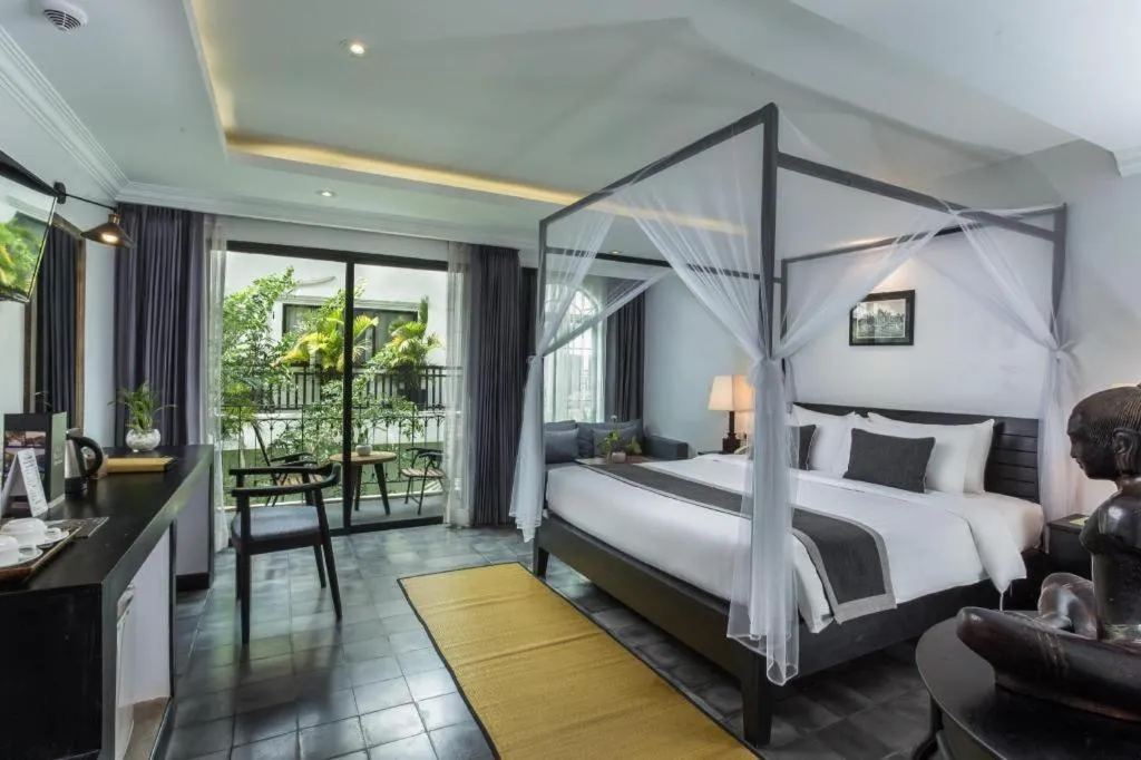Bed in The Grand Cyclo Boutique Suite & Spa