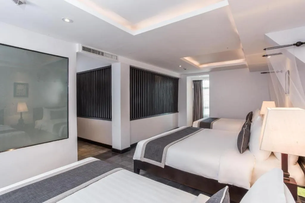 Bed in The Grand Cyclo Boutique Suite & Spa