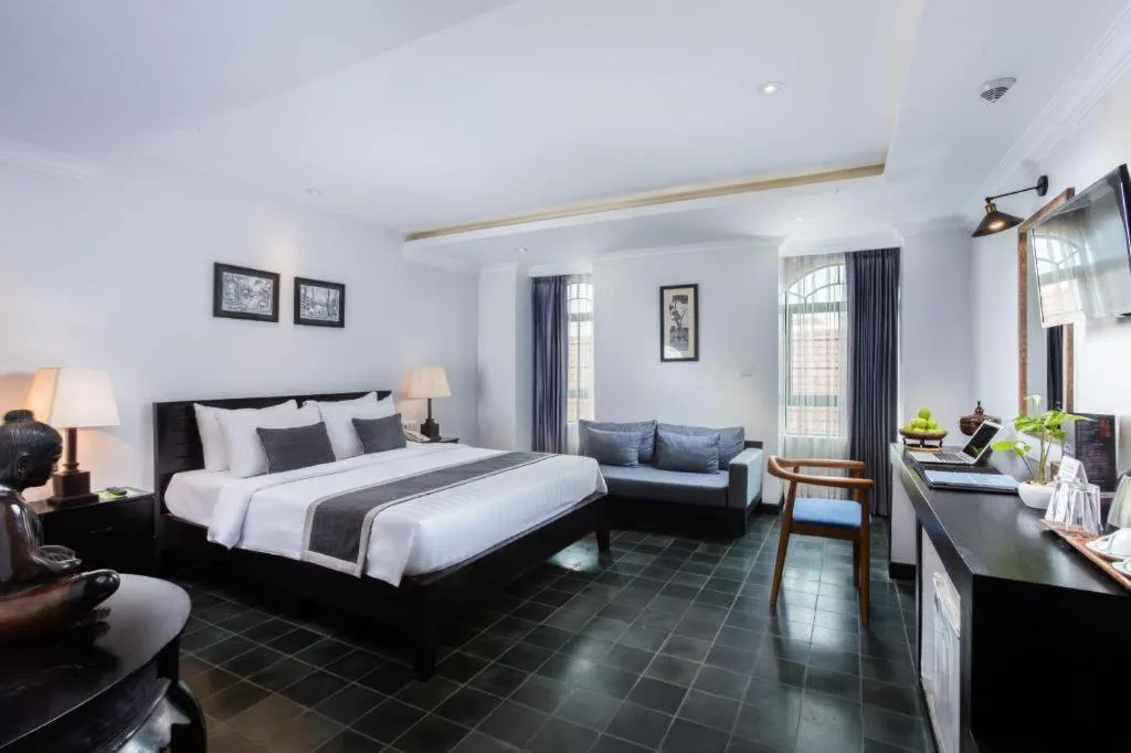 Bed in The Grand Cyclo Boutique Suite & Spa