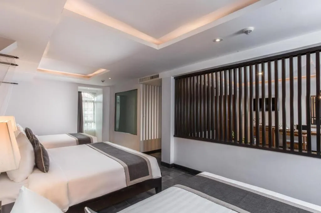 Bed in The Grand Cyclo Boutique Suite & Spa