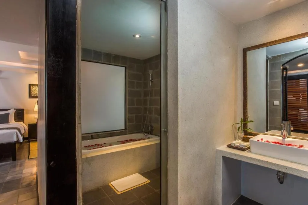 Bed in The Grand Cyclo Boutique Suite & Spa