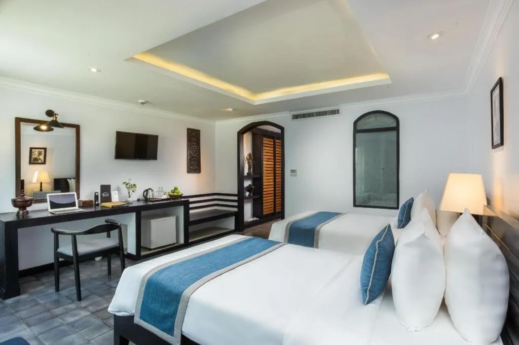 Bed in The Grand Cyclo Boutique Suite & Spa