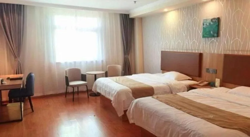 Bed in GreenTree Inn Kunshan Shimao Plaza Business Hotel