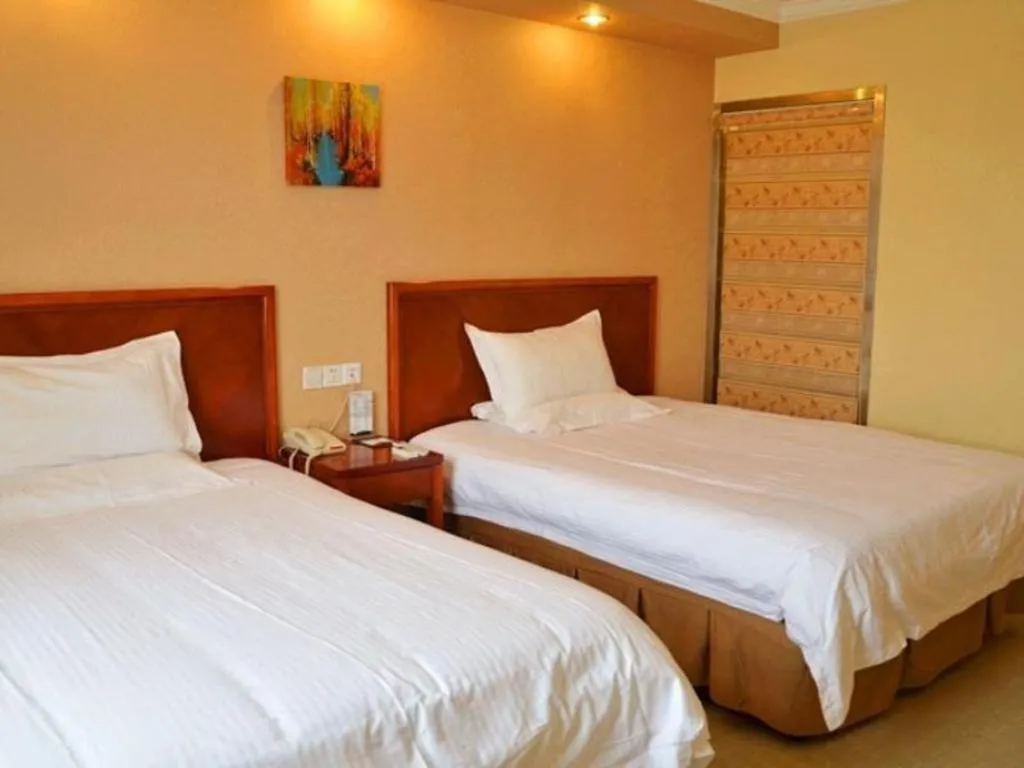Bed in GreenTree Inn Kunshan Shimao Plaza Business Hotel