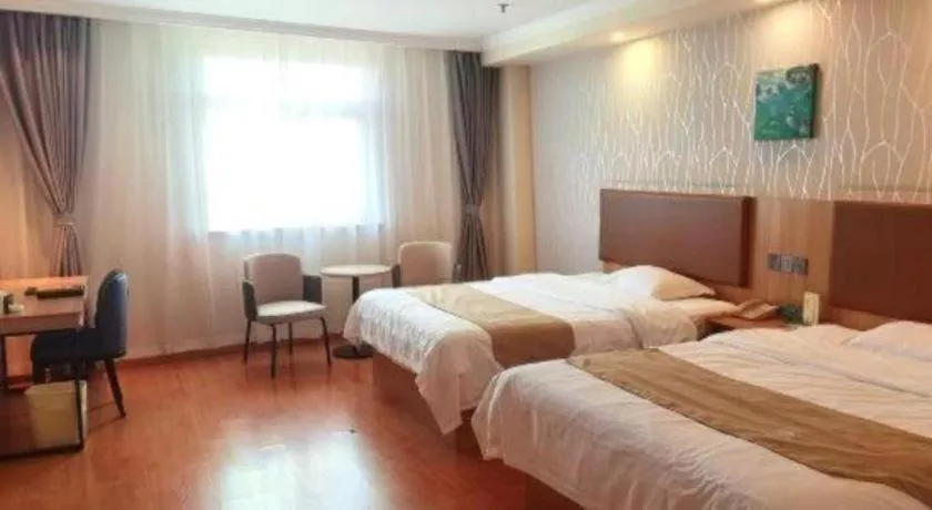 Bed in GreenTree Inn Kunshan Shimao Plaza Business Hotel