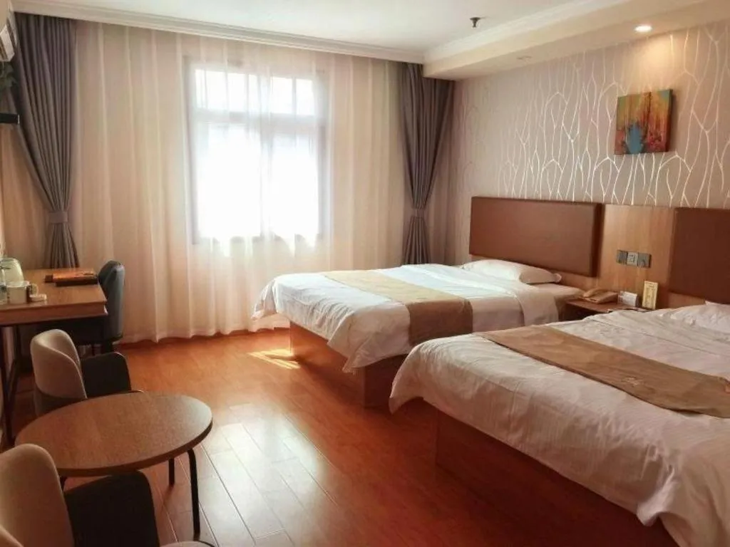 Bed in GreenTree Inn Kunshan Shimao Plaza Business Hotel