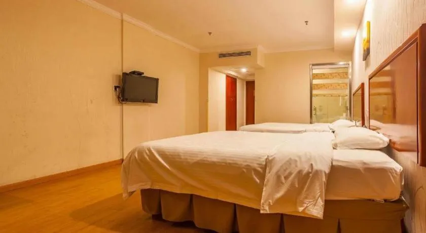 Bed in GreenTree Inn Kunshan Shimao Plaza Business Hotel