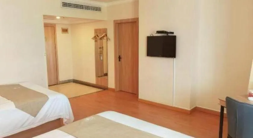 Bed in GreenTree Inn Kunshan Shimao Plaza Business Hotel